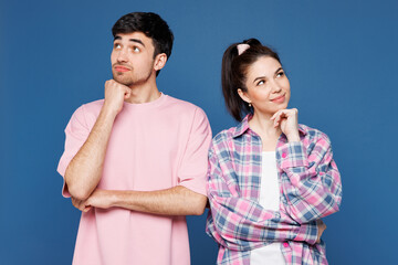 Young couple two friends family man woman they wear pink casual clothes together put hand prop up...