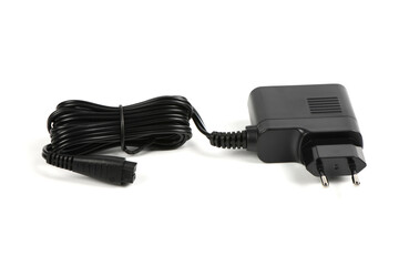 A black power supply. The wires are pulled together with a plastic-coated wire tie