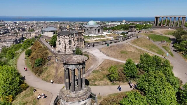 Aerial footage of Calton Hill overlooking Edinburgh, Scotland, United Kingdom