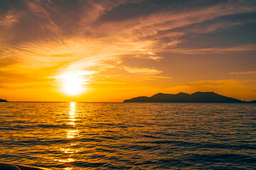 Front view in the indigo blue ocean in the morning, the sun was rising, reflections fell on the...