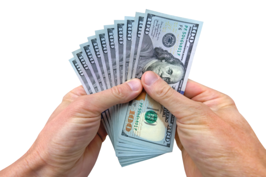 Hands holding stack of dollar bills money