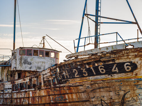 Close-up of a weathered fishing boat shipwreck in Camaret-sur-Mer, Brittany, France