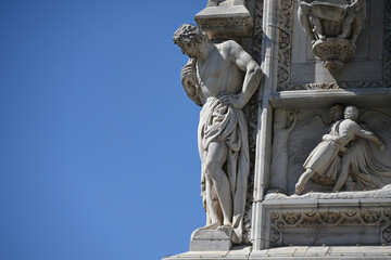 Milan, Italy - Candoglia marble statues and bas reliefs on the facade of the Duomo cathedral