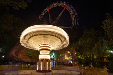 Night at Tashkent Central Park: Spinning Ride and Ferris Wheel, Uzbekistan