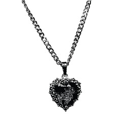 Heartshaped vintage pendant necklace in halftone stipple effect. Retro  texture with grunge and punk rock aesthetics. nostalgic and gothic-themed design
