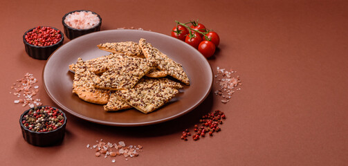 Crispbread, thin bread with seeds and grains, a baked cracker. Crispbread with sesame seeds