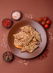 Crispbread, thin bread with seeds and grains, a baked cracker. Crispbread with sesame seeds