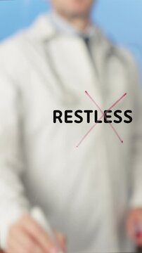 Medical professional wearing white coat crossing out word restless on transparent board, symbolizing overcoming mental health challenges in clinical setting against blue backdrop