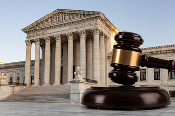 courtroom gavel and against majestic judicial building, legal system representation
