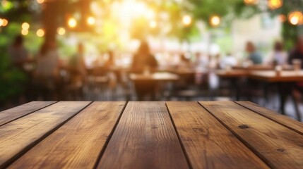 Wooden empty table top with a blurred background of people dining in an outdoor cafe or restaurant