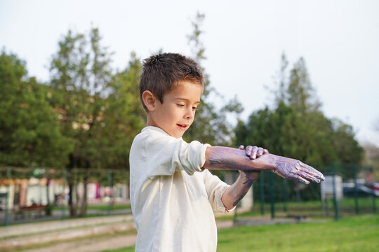 Little boy exploring creativity in the park