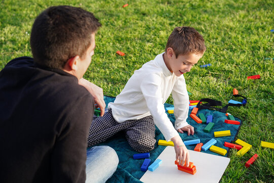 Father and son enjoying playful time in the park
