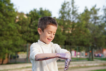 Little boy enjoying outdoor play in sunny park