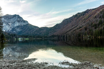 Mountain lake in Salzkammergut, Austria with forested slopes and alpine reflections
