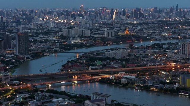 Night hyperlapse of Luanda Bay, featuring vibrant city lights reflecting on the water, illuminated buildings, and dynamic traffic. Perfect for urban, cityscape, or African city projects