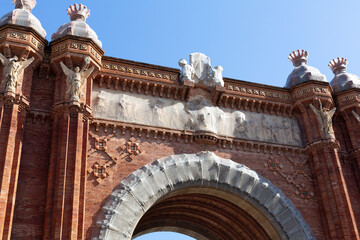 Arc de triomf showing intricate brickwork and sculptures in barcelona, spain