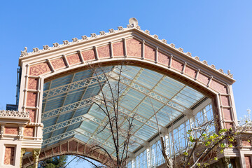 Elegant glass and metal canopy covering building entrance in madrid
