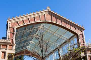 Elegant glass and metal canopy covering building entrance in madrid
