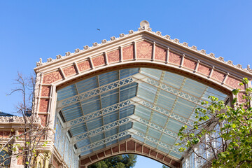 Elegant glass and metal canopy covering building entrance in madrid