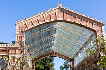 Elegant glass and metal canopy covering building entrance in madrid