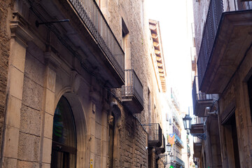 Narrow street with catalan flags flying in barcelona's gothic quarter
