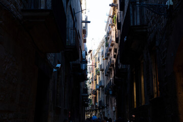 Narrow street with catalan flags flying in barcelona's gothic quarter