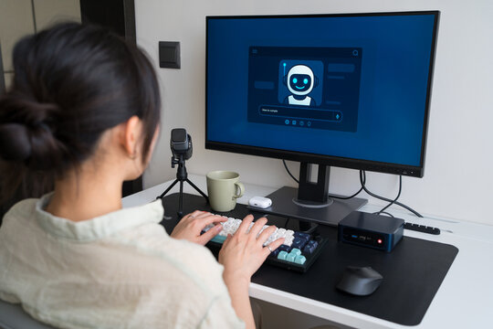 Young professional using robot assistant for tasks