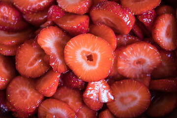 Fresh strawberry slices for artisan jam creation
