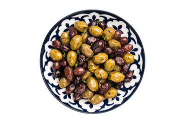 Mix olives with herbs and oil in plate isolated on white background.