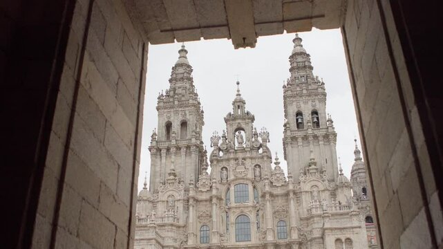 Praza do Obradoiro or Obradeiro square in Santiago de Compostela, Spain. Famous Camino de Santiago World Heritage pilgrims' way of Cami&ntilde;o de Santiago final target. 4K Cathedral towers footage
