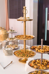 gold and silver food tower appetisers