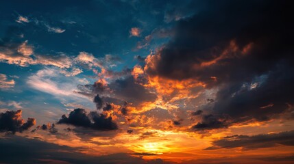 Fototapeta premium Vivid Sunset With Fiery Clouds Overhead and Soft Light Reflection on the Horizon Landscape Ideal for Nature Themes and Backgrounds