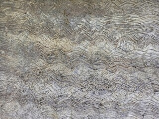 Abstract Wavy Lines Engraved on Textured Concrete