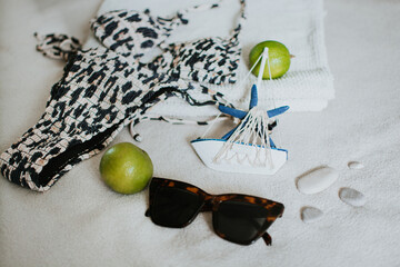 Leopard swimsuit, towel, slippers, glasses and other things for a seaside vacation