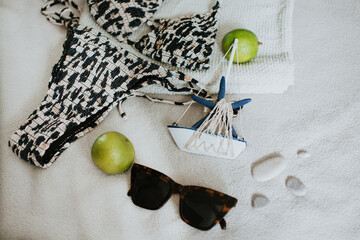 Leopard swimsuit, towel, slippers, glasses and other things for a seaside vacation