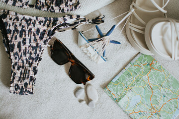 Leopard swimsuit, towel, slippers, glasses, navigation map and other things for a seaside vacation