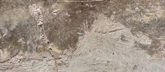 Heavily Damaged and Scratched Concrete Surface with Debris