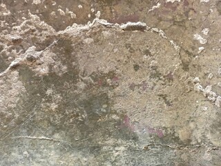 Severely Deteriorated Concrete Surface with Flaking and Stains