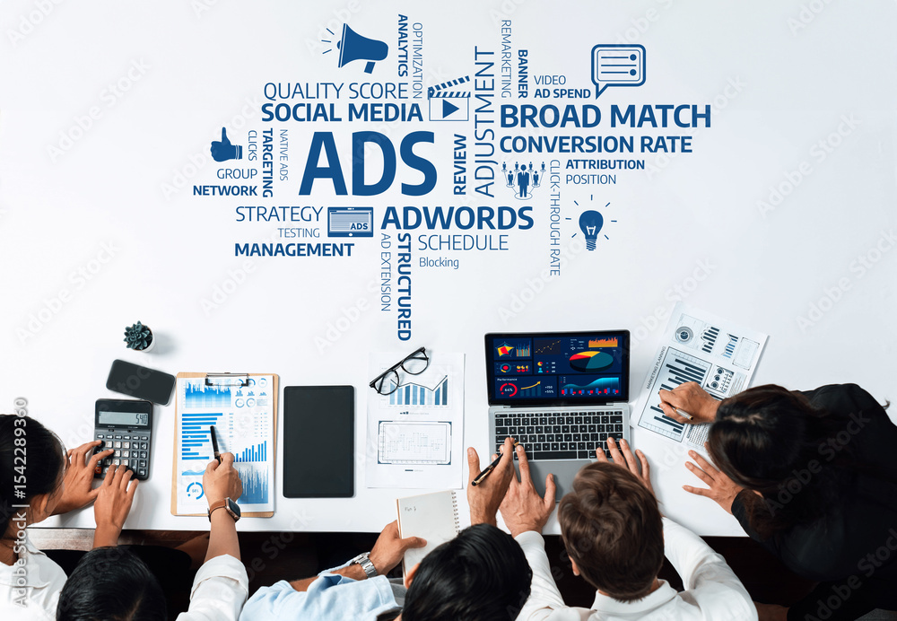 Aufkleber A dynamic team collaborates around a data-driven workspace, focusing on key advertising metrics, strategy development, and performance analysis in a modern business setting. Amity