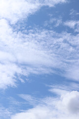 Fototapeta premium White clouds against the blue sky. Sky background. Summer. Landscape. Soft white clouds against the blue sky. Calm and serene atmosphere. White fluffy clouds