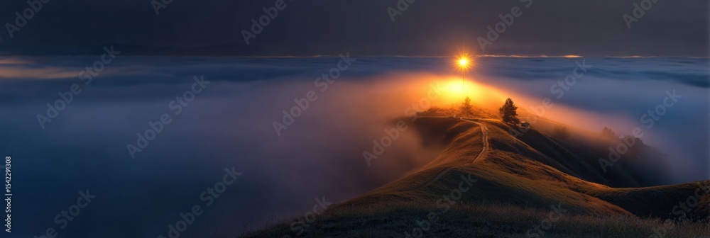Poster fog envelops a head-shaped landscape with a glowing beacon casting light above
