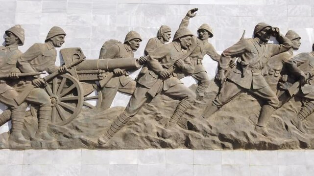 Bas-relief Sculpture Depicting Soldiers in Combat