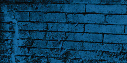 Vertical and horizontal lines of a textured blue wall, creating a strong sense of structure and orderly repetition.
