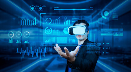 Project manager with VR goggles holding financial chart and glowing blue light at office. Skilled businessman checking and planning marketing strategy by using data from augmented reality. Ingenuity.