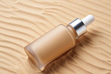 Frosted Glass Dropper Bottle on Sandy Surface Skincare Product Mockup