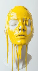 Bright yellow paint drips down the face of a white mannequin against a plain background