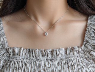 3D small flower crystal chain silver necklace for women and girls, minimalist style white gold chain with a diamond pendant on the neck of an Asian woman wearing a dress