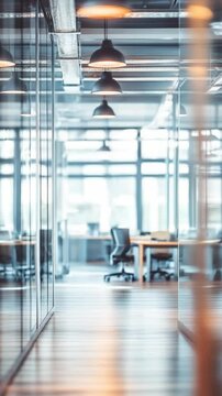 Modern bright office interior with blurred background showing workspace during daytime, office out of focus