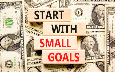Start with small goals symbol. Concept words phrase Start with small goals on beautiful blocks....