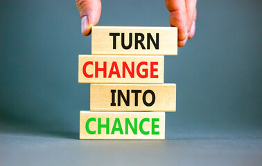 Turn change into chance symbol. Concept words phrase Turn change into chance on beautiful wooden...